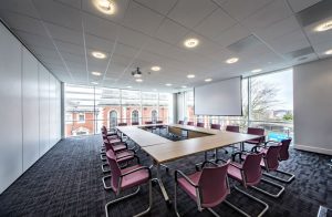 View of tables and chairs set up for a meeting